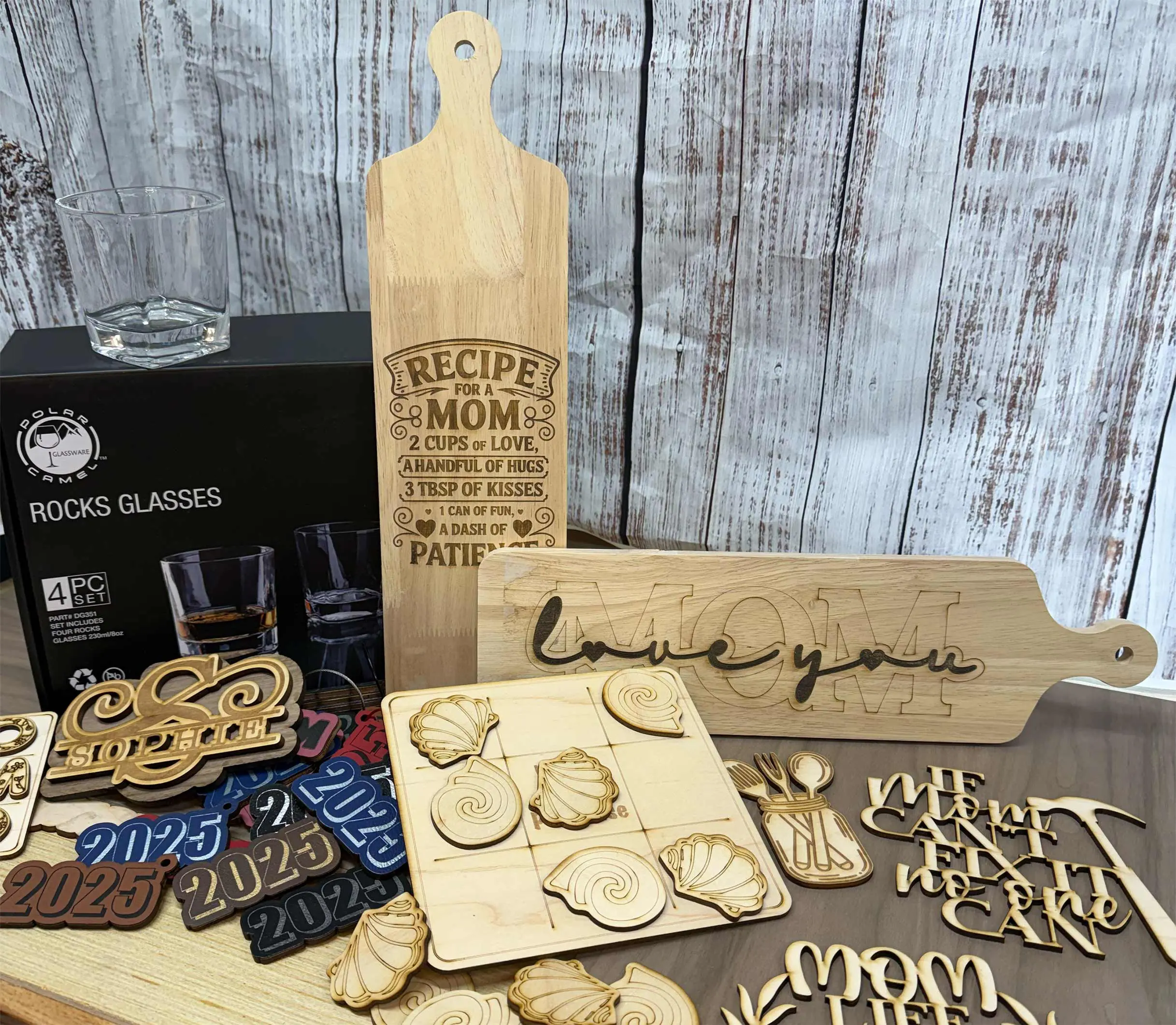 A table with wooden cutting boards and other wood items.