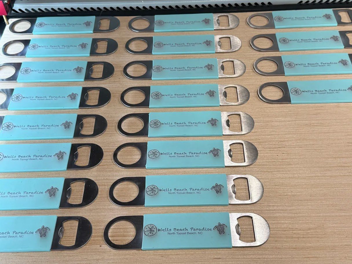 A table with several different sized bottle openers.