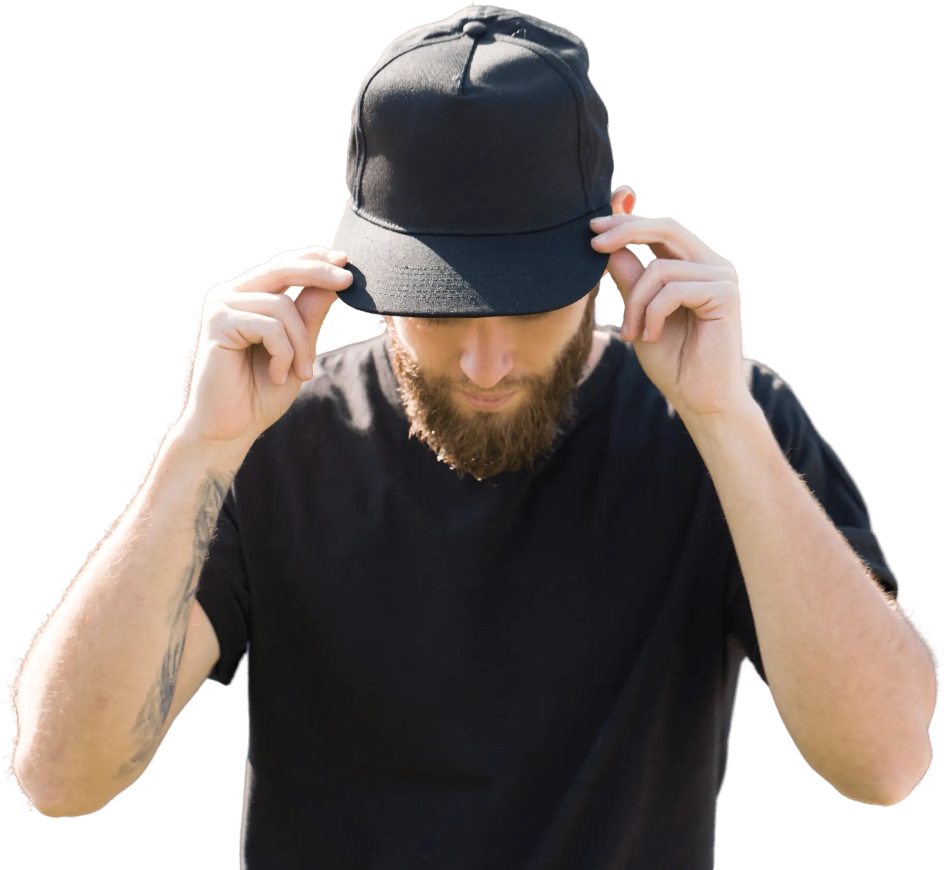 Man adjusting black cap, wearing black shirt.
